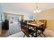 Dining area with wood table and chairs, opens to living room at 2285 Israeli Dr # 29, Clearwater, FL 33763