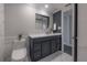 Bathroom with dark vanity, white countertop, and marble flooring at 4141 Bayshore Blvd # 1003, Tampa, FL 33611
