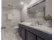 Elegant bathroom featuring marble tile, a modern vanity, and a clean design at 4141 Bayshore Blvd # 1003, Tampa, FL 33611