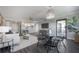 Open concept dining area with glass table and black chairs, adjacent to kitchen at 4141 Bayshore Blvd # 1003, Tampa, FL 33611