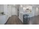 Open concept kitchen with breakfast bar and dark hardwood floors at 4141 Bayshore Blvd # 1003, Tampa, FL 33611