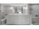 Elegant bathroom with double vanity and marble tile at 4141 Bayshore Blvd # 1003, Tampa, FL 33611