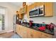 Well-equipped kitchenette with stainless steel appliances at 36431 Florrie Mae Ln, Dade City, FL 33523
