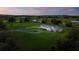 Beautiful aerial view of a sprawling country estate with lush green fields and a long winding driveway at 36431 Florrie Mae Ln, Dade City, FL 33523