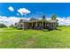 One-story home with a large front porch and stone accents at 36431 Florrie Mae Ln, Dade City, FL 33523