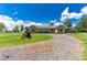 Ranch style home with large yard and driveway at 36431 Florrie Mae Ln, Dade City, FL 33523