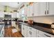 Modern kitchen with farmhouse sink and dark granite countertops at 36431 Florrie Mae Ln, Dade City, FL 33523