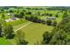 Aerial view of property showcasing house and expansive land at 36431 Florrie Mae Ln, Dade City, FL 33523