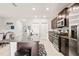 Modern kitchen with dark cabinets and granite countertops at 5070 White Chicory Dr, Apollo Beach, FL 33572