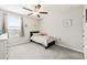 Bright bedroom with window, ceiling fan, and carpeting at 5070 White Chicory Dr, Apollo Beach, FL 33572