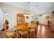 Rustic farmhouse dining room with wood table and light fixture at 36431 Florrie Mae Ln, Dade City, FL 33523