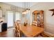 Bright dining room with wooden table and hutch at 36431 Florrie Mae Ln, Dade City, FL 33523