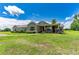House exterior showcasing a covered porch and landscaping at 36431 Florrie Mae Ln, Dade City, FL 33523