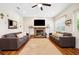 Spacious living room with fireplace and hardwood floors at 36431 Florrie Mae Ln, Dade City, FL 33523