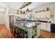 Spacious kitchen with island and farmhouse style cabinets at 36431 Florrie Mae Ln, Dade City, FL 33523