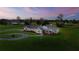 Ranch style home with a large front yard and beautiful sunset at 36431 Florrie Mae Ln, Dade City, FL 33523