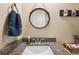 Small bathroom boasts granite countertop and updated vanity at 36431 Florrie Mae Ln, Dade City, FL 33523