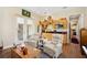 Open living area with kitchenette and access to patio at 36431 Florrie Mae Ln, Dade City, FL 33523