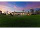 Ranch style home with a large front yard and beautiful sunset at 36431 Florrie Mae Ln, Dade City, FL 33523