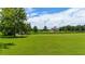 Aerial view of house and expansive green lawn, showcasing the property's serene setting at 36431 Florrie Mae Ln, Dade City, FL 33523