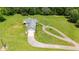 Aerial view of a ranch-style home with a long driveway at 36431 Florrie Mae Ln, Dade City, FL 33523