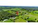 Wide aerial view showing the property's location in a rural area at 36431 Florrie Mae Ln, Dade City, FL 33523