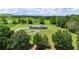 Aerial view of a house with a large backyard and a circular driveway at 36431 Florrie Mae Ln, Dade City, FL 33523