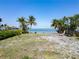 Vacant lot with tropical landscaping and ocean views at 1013 Symphony Isles Blvd, Apollo Beach, FL 33572