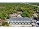 Aerial view of home, showing surrounding neighborhood with mature trees at 5530 N 9Th St # 3, Tampa, FL 33604