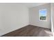 Bright bedroom features hardwood floors, large window, and neutral paint at 5530 N 9Th St # 3, Tampa, FL 33604