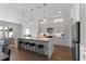 Bright kitchen with marble countertops, pendant lighting, stainless steel appliances, and hardwood floors at 5530 N 9Th St # 3, Tampa, FL 33604