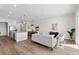 Open-concept living area featuring a modern kitchen, dining area, and seating area with hardwood floors at 5530 N 9Th St # 3, Tampa, FL 33604