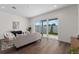 Open living room with hardwood floors, large glass sliding doors to the backyard, and neutral décor at 5530 N 9Th St # 3, Tampa, FL 33604