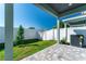 Outdoor patio with stone pavers, fenced backyard, and well-maintained landscaping at 5530 N 9Th St # 3, Tampa, FL 33604