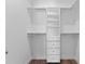 Organized walk-in closet with shelves, drawers, and hanging rods for ample storage at 5530 N 9Th St # 3, Tampa, FL 33604