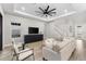 Bright and airy living room with large sectional sofa and built-in entertainment center at 1039 Seagrape Dr, Ruskin, FL 33570