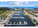 Aerial view of a marina with numerous boats and yachts at 1039 Seagrape Dr, Ruskin, FL 33570