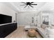 Living room with sectional sofa and large TV, open to kitchen at 1039 Seagrape Dr, Ruskin, FL 33570