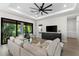 Spacious living room with sliding doors leading to a private patio and backyard at 1039 Seagrape Dr, Ruskin, FL 33570