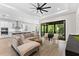 Open living room with a view of modern kitchen and breakfast area at 1039 Seagrape Dr, Ruskin, FL 33570