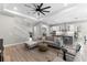 Open concept living room, kitchen, and dining area with hardwood floors and ceiling fan at 1039 Seagrape Dr, Ruskin, FL 33570