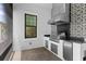 Stainless steel outdoor kitchen with built-in grill and black and white tile at 1039 Seagrape Dr, Ruskin, FL 33570