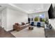 Spacious Gathering room with brown leather sofa and two blue armchairs at 1039 Seagrape Dr, Ruskin, FL 33570