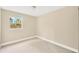 Spacious bedroom with neutral walls and carpeted floor at 6027 Flora Ter, Apollo Beach, FL 33572