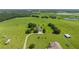 Aerial view of estate features expansive land with distant ponds and mature trees at 34868 Prospect Rd, Dade City, FL 33525