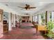 Spacious sunroom with brick floors, and views of the backyard at 34868 Prospect Rd, Dade City, FL 33525