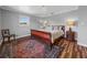Spacious primary bedroom with hardwood floors and a large window at 34868 Prospect Rd, Dade City, FL 33525