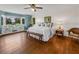 Main bedroom with wood floors, bay window, and a view at 34868 Prospect Rd, Dade City, FL 33525