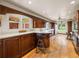 Kitchen with dark wood cabinets and hardwood floors at 34868 Prospect Rd, Dade City, FL 33525