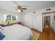 Large bedroom with wood floors and access to the hallway at 34868 Prospect Rd, Dade City, FL 33525